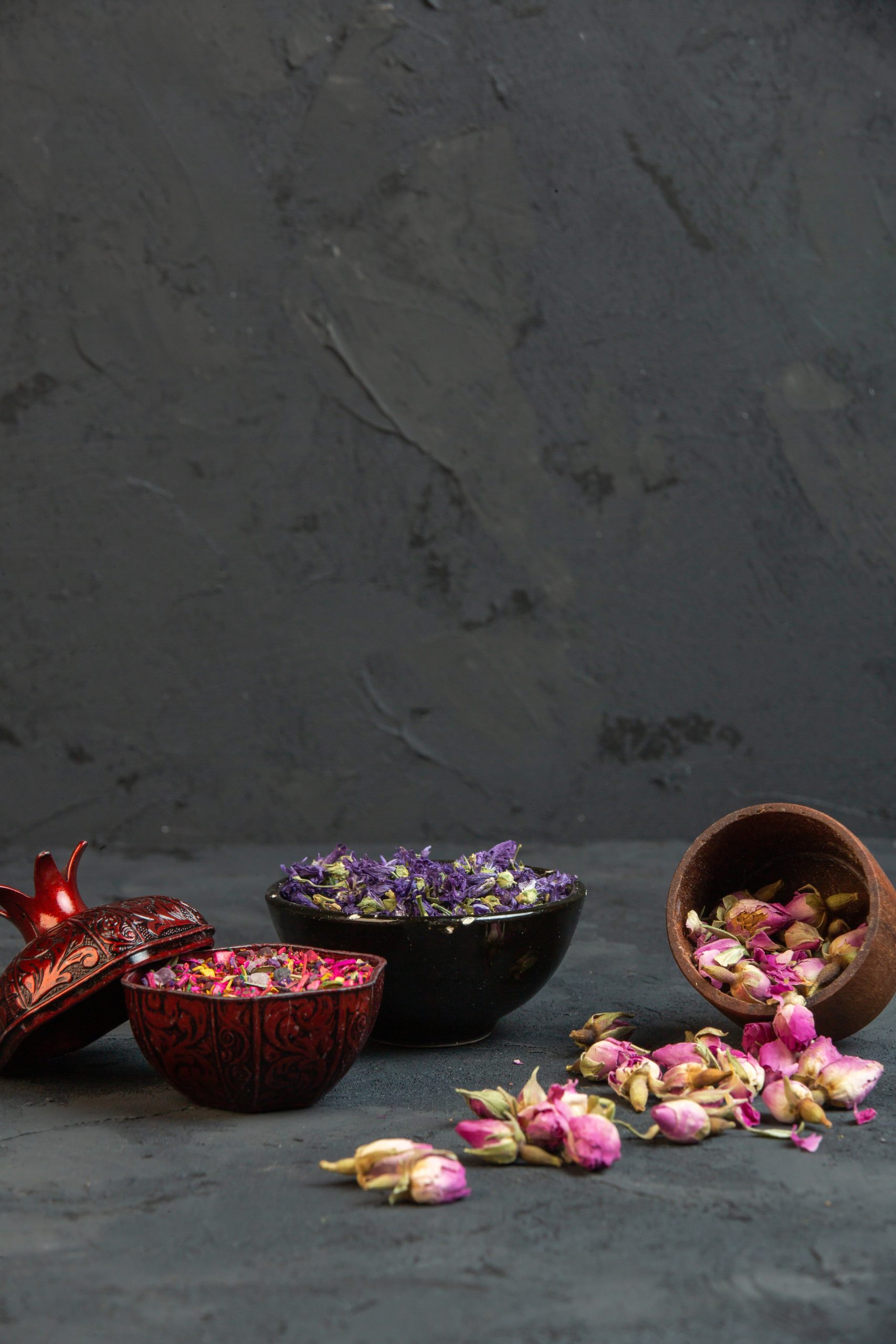 front-view-dry-pink-roses-scattered-from-jar-with-purple-dried-flowers-vase-scaled.jpg